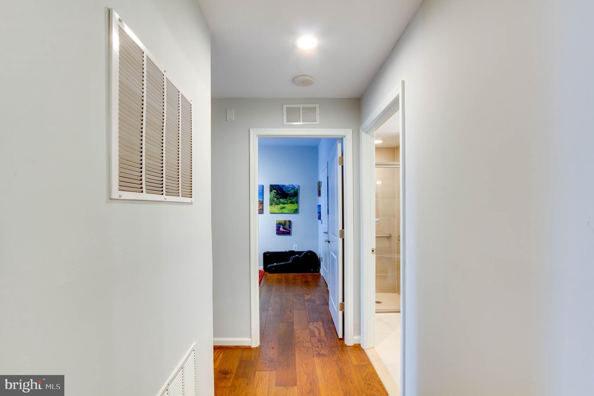 11990 Market Street, Unit 217 Reston, VA 20190 - Photo 4 of 82 Hall to Bedroom 2 and 3