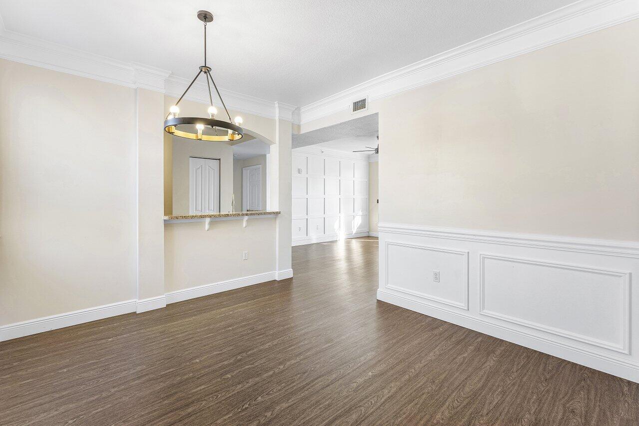 276 Murcia Drive, Unit 301 Jupiter, FL 33458 - Photo 11 of 52 a view of empty room with wooden floor