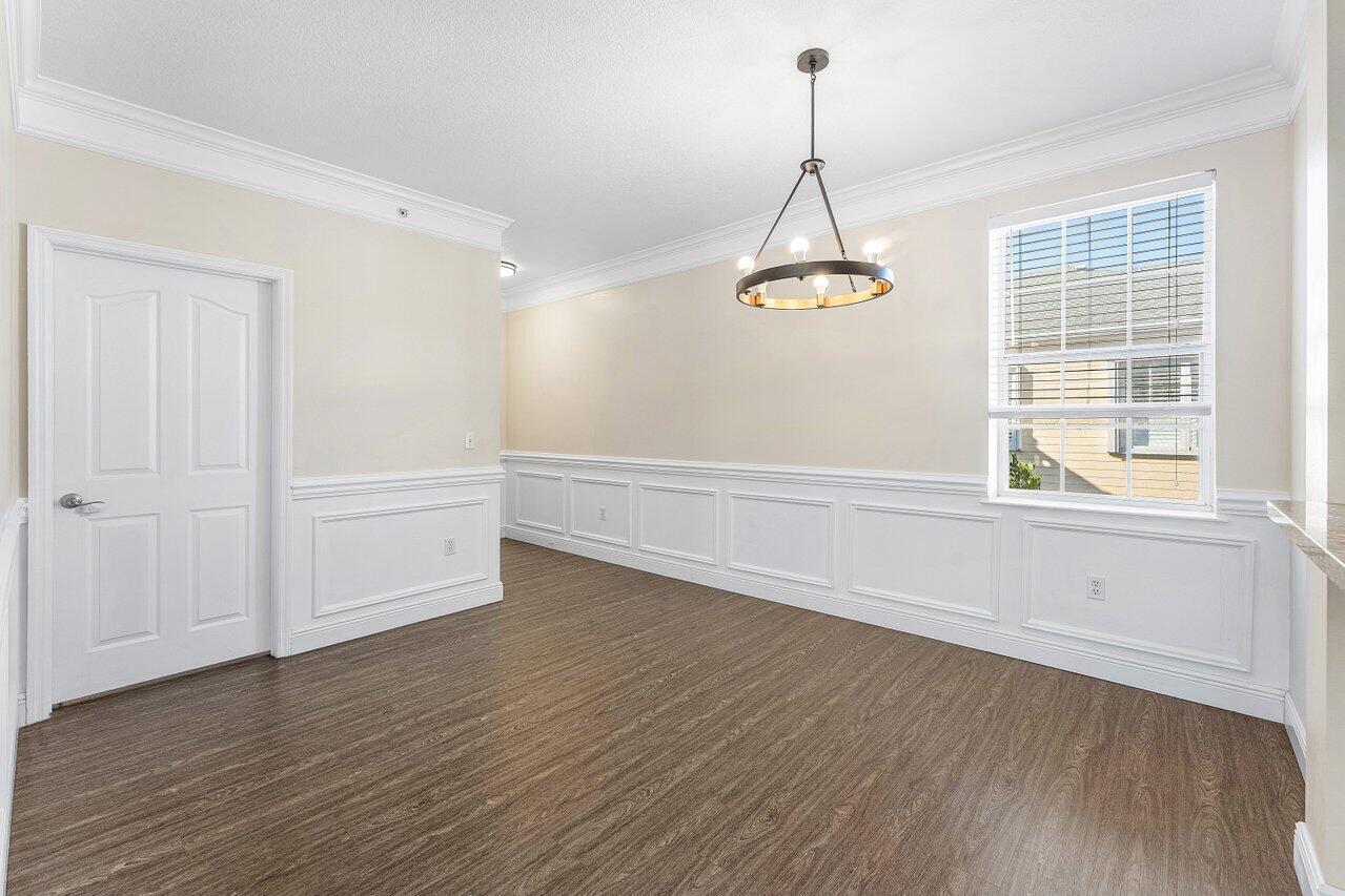 276 Murcia Drive, Unit 301 Jupiter, FL 33458 - Photo 12 of 52 a view of empty room with wooden floor and window