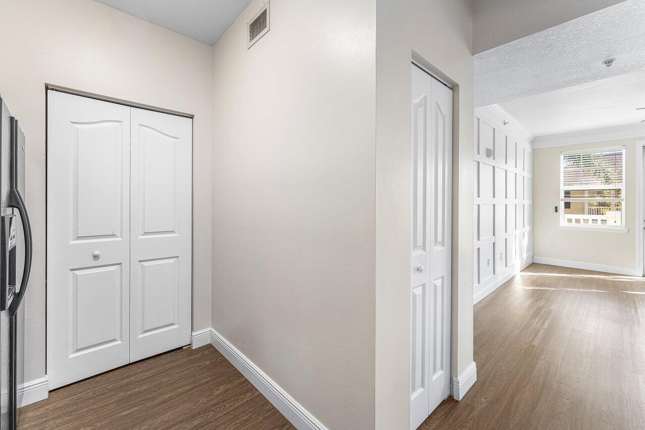 276 Murcia Drive, Unit 301 Jupiter, FL 33458 - Photo 14 of 52 a view of a hallway with wooden floor