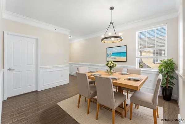 a view of a dining room with furniture window and wooden floor
