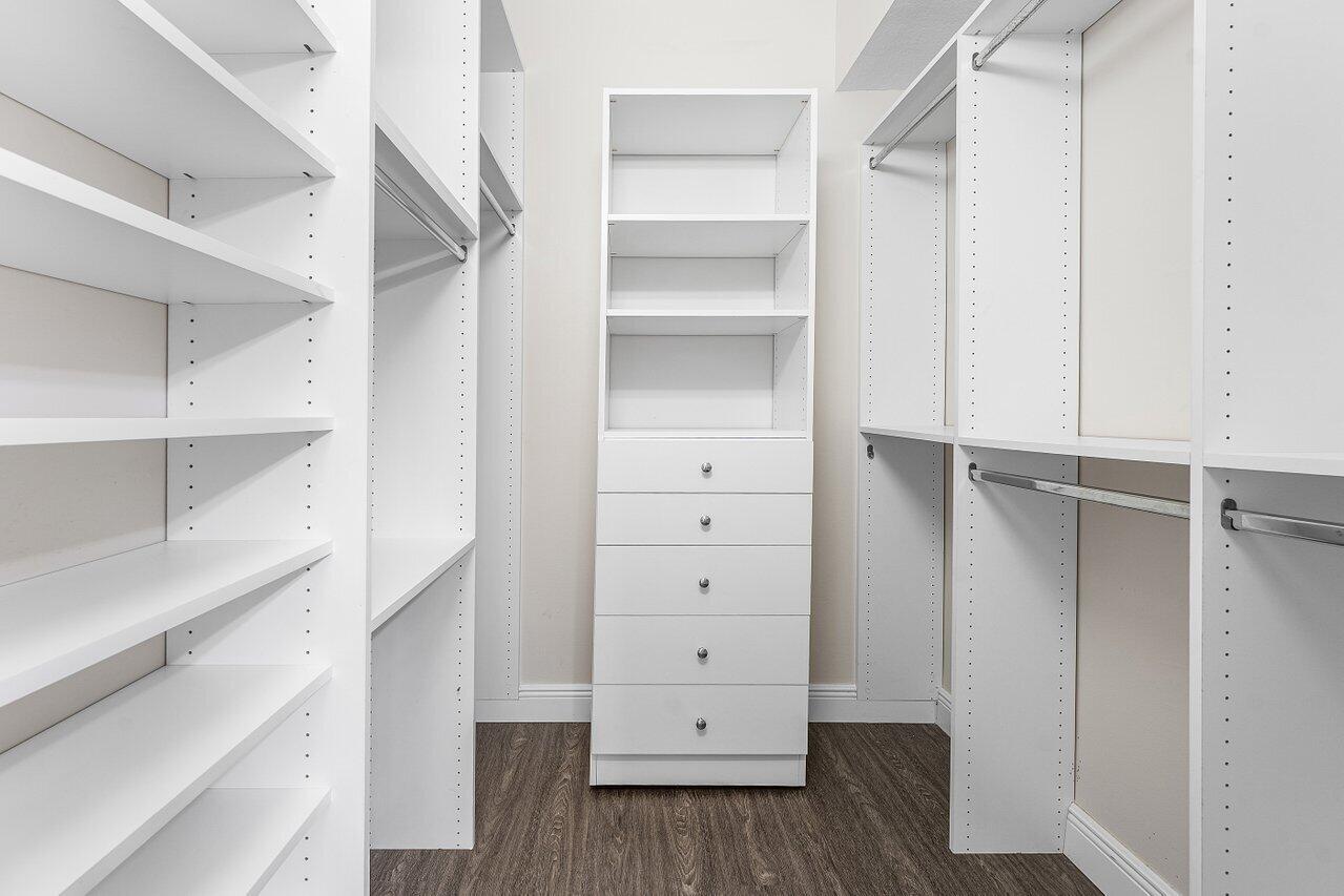 276 Murcia Drive, Unit 301 Jupiter, FL 33458 - Photo 27 of 52 a view of walk in closet with empty racks