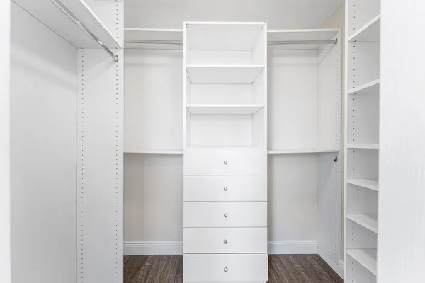 a bathroom with a sink a tub and a mirror