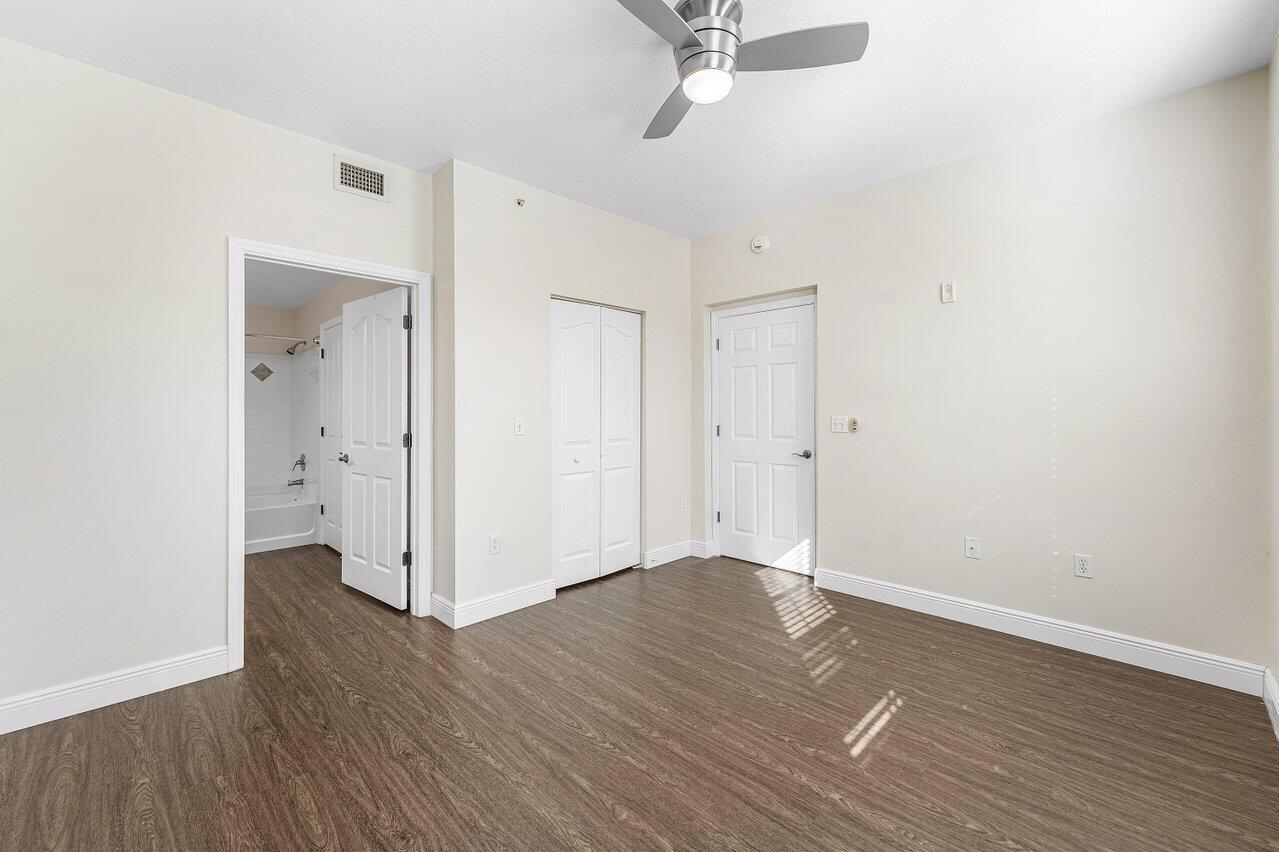 276 Murcia Drive, Unit 301 Jupiter, FL 33458 - Photo 31 of 52 a view of an empty room with wooden floor
