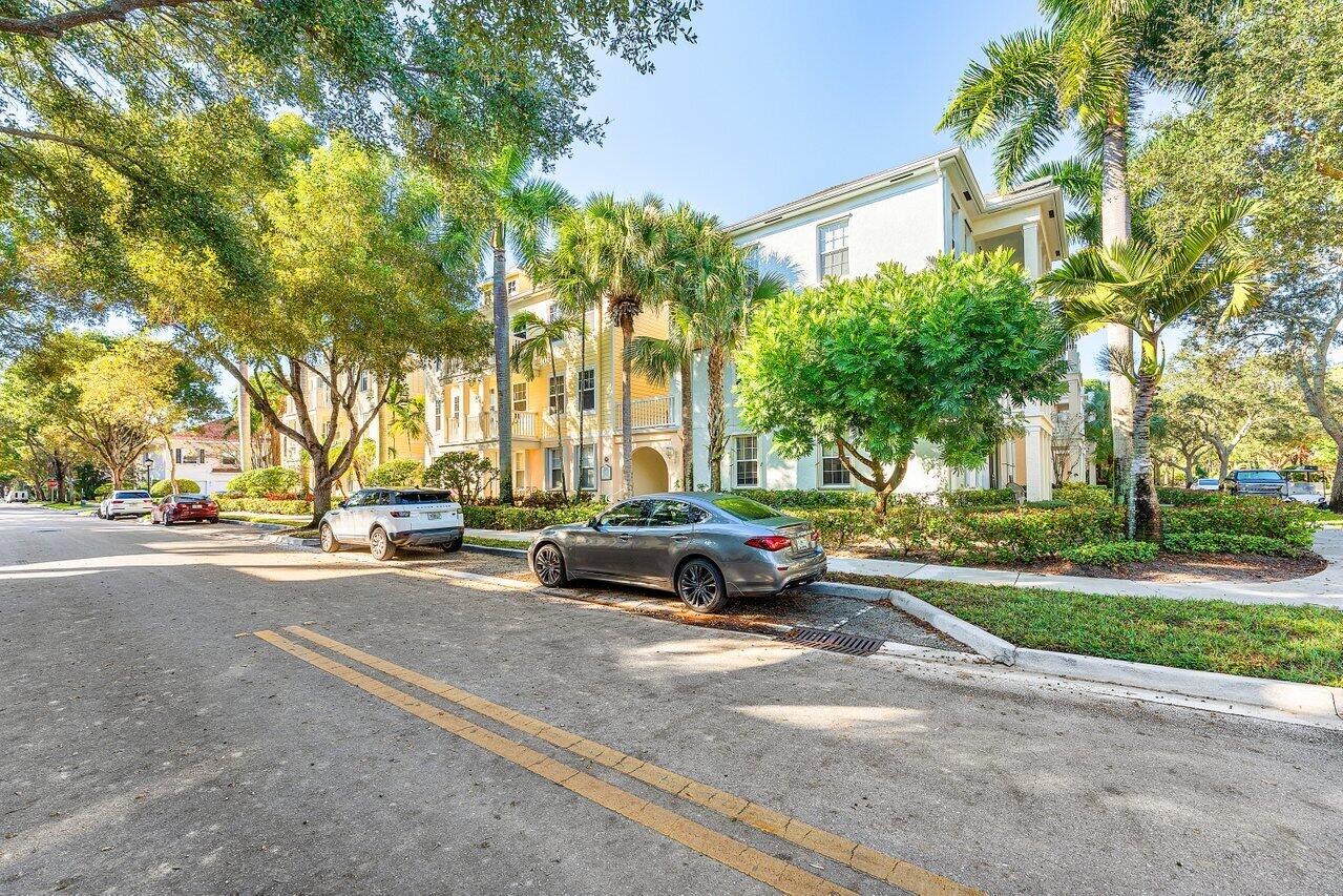 276 Murcia Drive, Unit 301 Jupiter, FL 33458 - Photo 35 of 52 a car parked on the side of a street