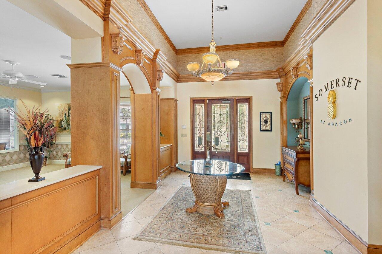 276 Murcia Drive, Unit 301 Jupiter, FL 33458 - Photo 39 of 52 a very nice looking room with a large window and chandelier
