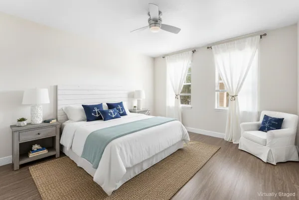 a bedroom with a bed and a couch