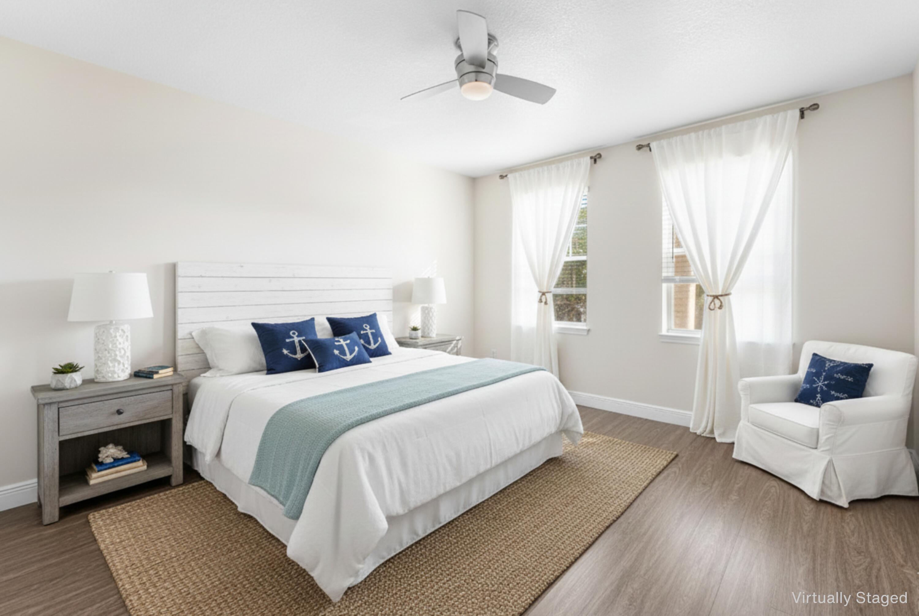 276 Murcia Drive, Unit 301 Jupiter, FL 33458 - Photo 4 of 52 a bedroom with a bed and a couch