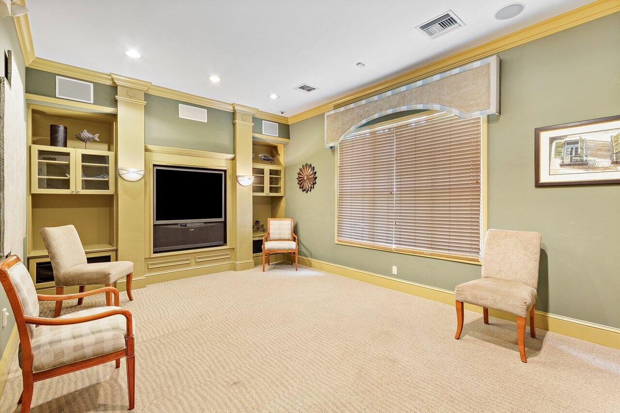 276 Murcia Drive, Unit 301 Jupiter, FL 33458 - Photo 45 of 52 a living room with furniture and a flat screen tv