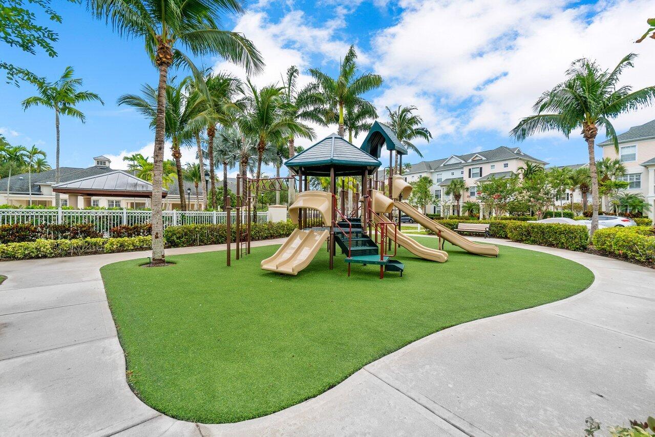 276 Murcia Drive, Unit 301 Jupiter, FL 33458 - Photo 49 of 52 a view of outdoor space yard deck patio and swimming pool