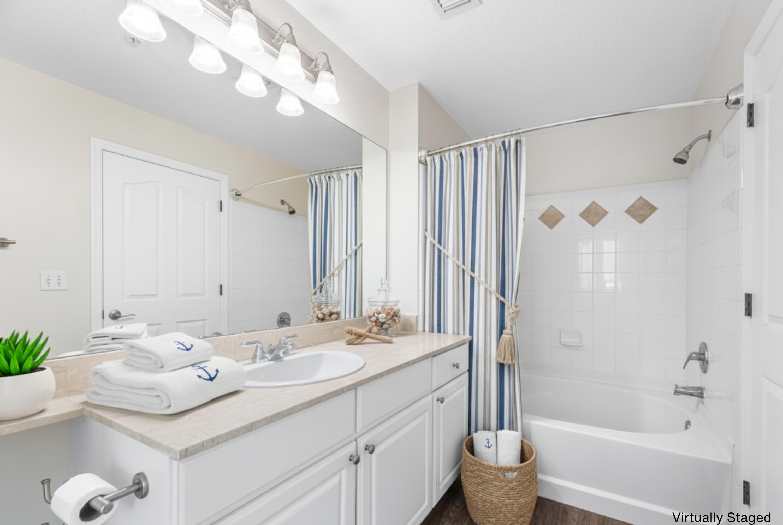 276 Murcia Drive, Unit 301 Jupiter, FL 33458 - Photo 7 of 52 a bathroom with a sink vanity tub and shower