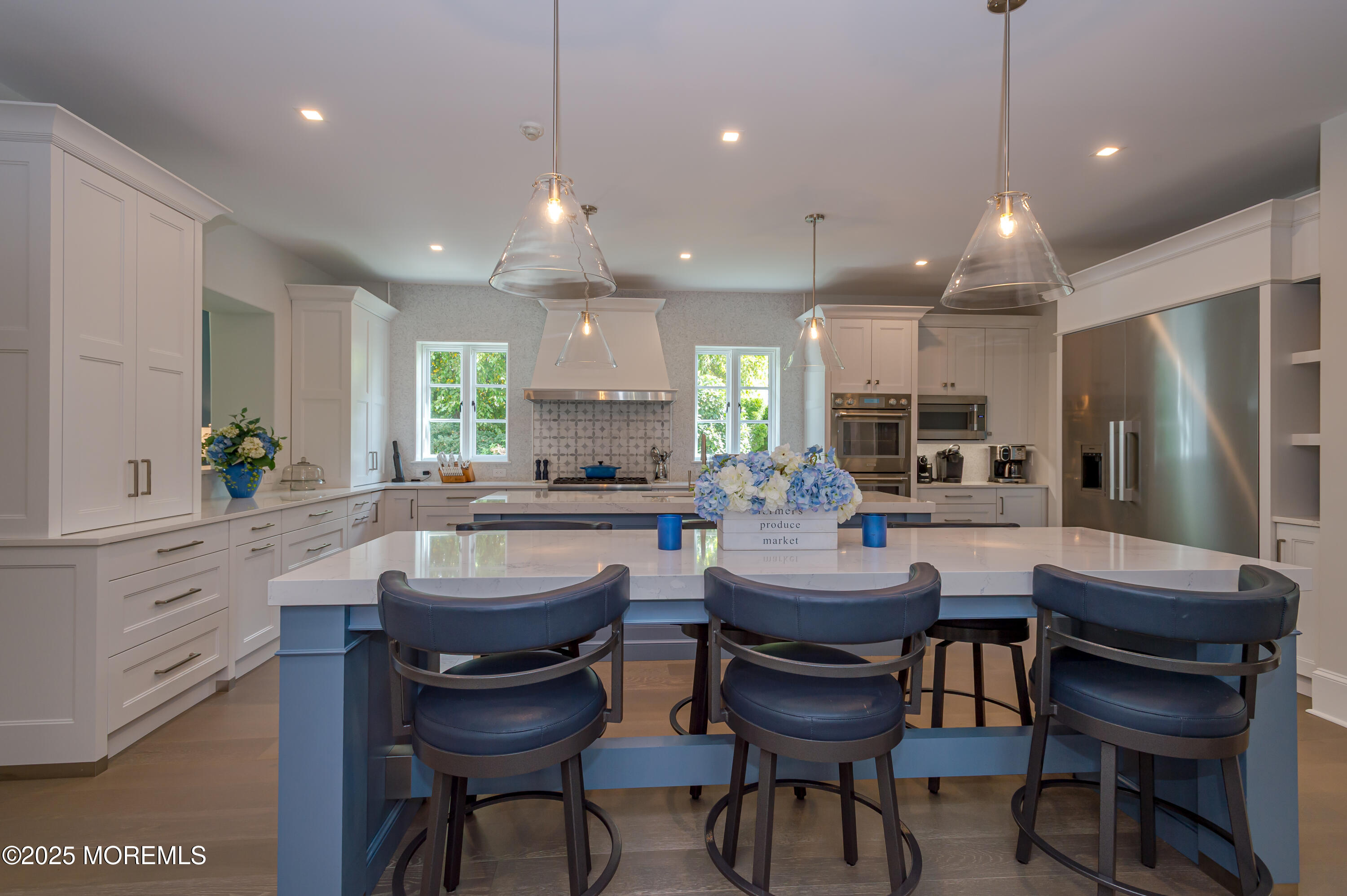 112 Passaic Avenue Spring Lake, NJ 07762 - Photo 16 of 69 a kitchen with a dining table chairs and refrigerator