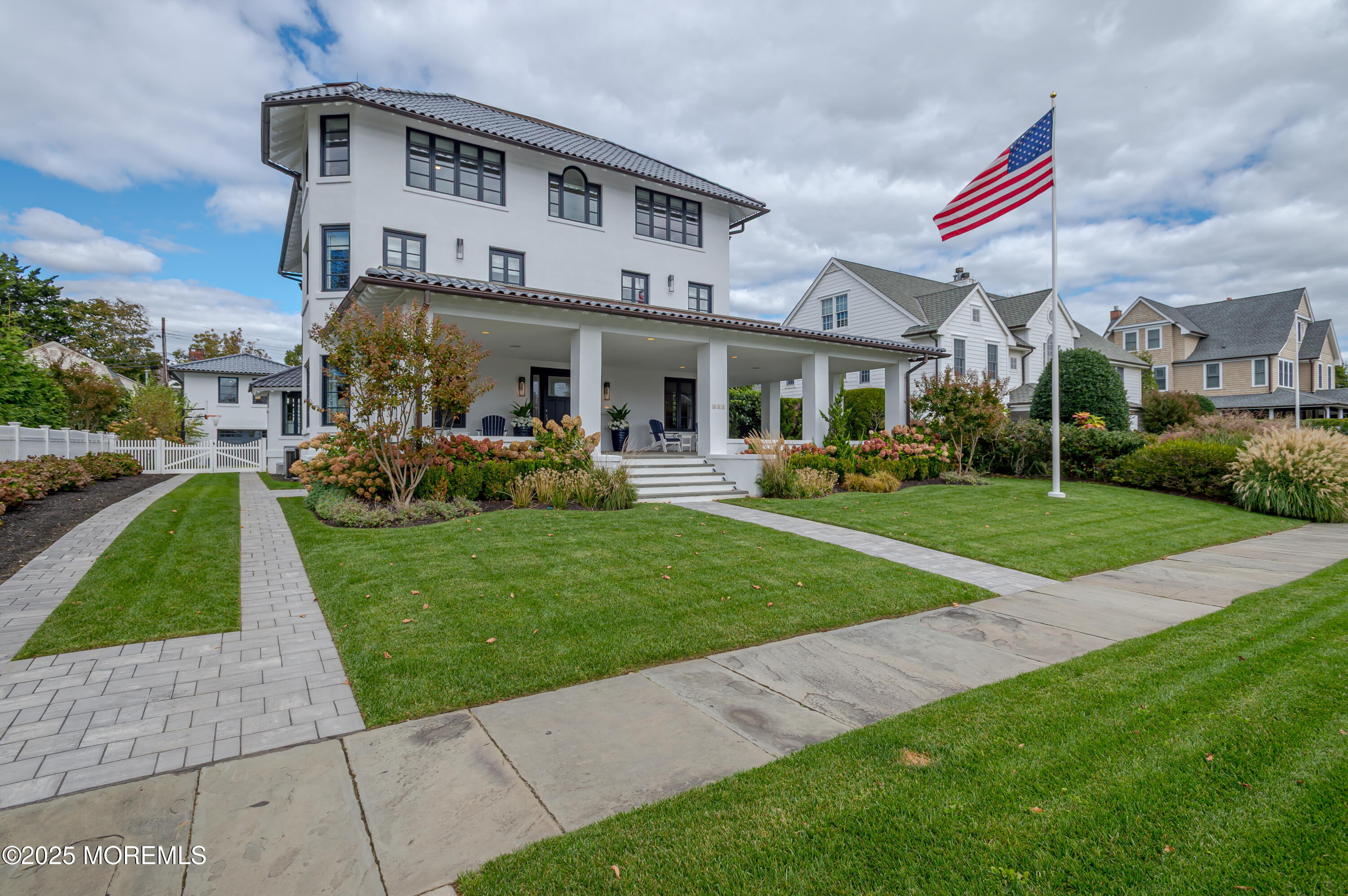 112 Passaic Avenue Spring Lake, NJ 07762 - Photo 2 of 69 a front view of a house with a yard