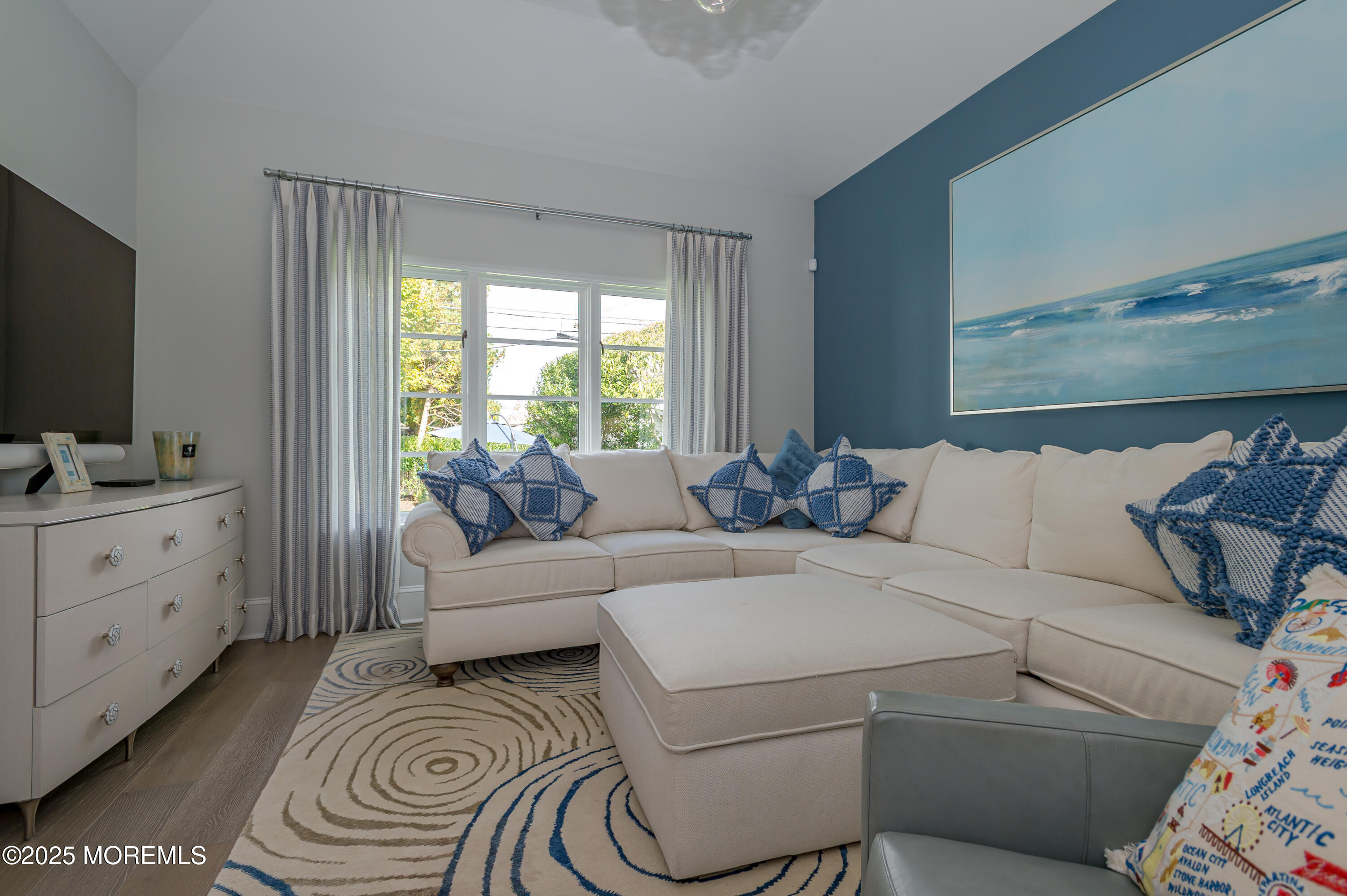 112 Passaic Avenue Spring Lake, NJ 07762 - Photo 22 of 69 a living room with furniture and a flat screen tv