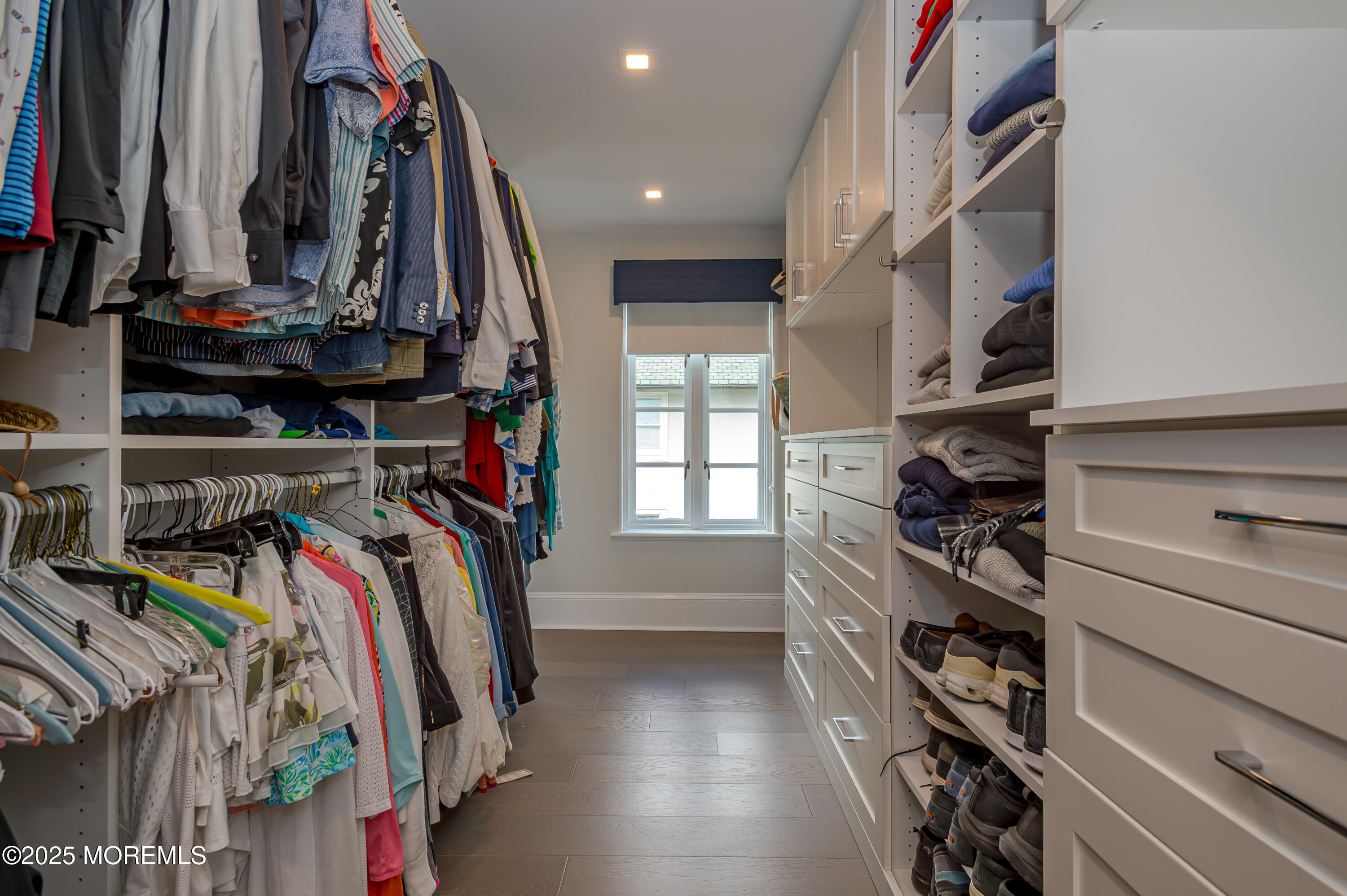 112 Passaic Avenue Spring Lake, NJ 07762 - Photo 25 of 69 a view of walk in closet with clothes and shoes