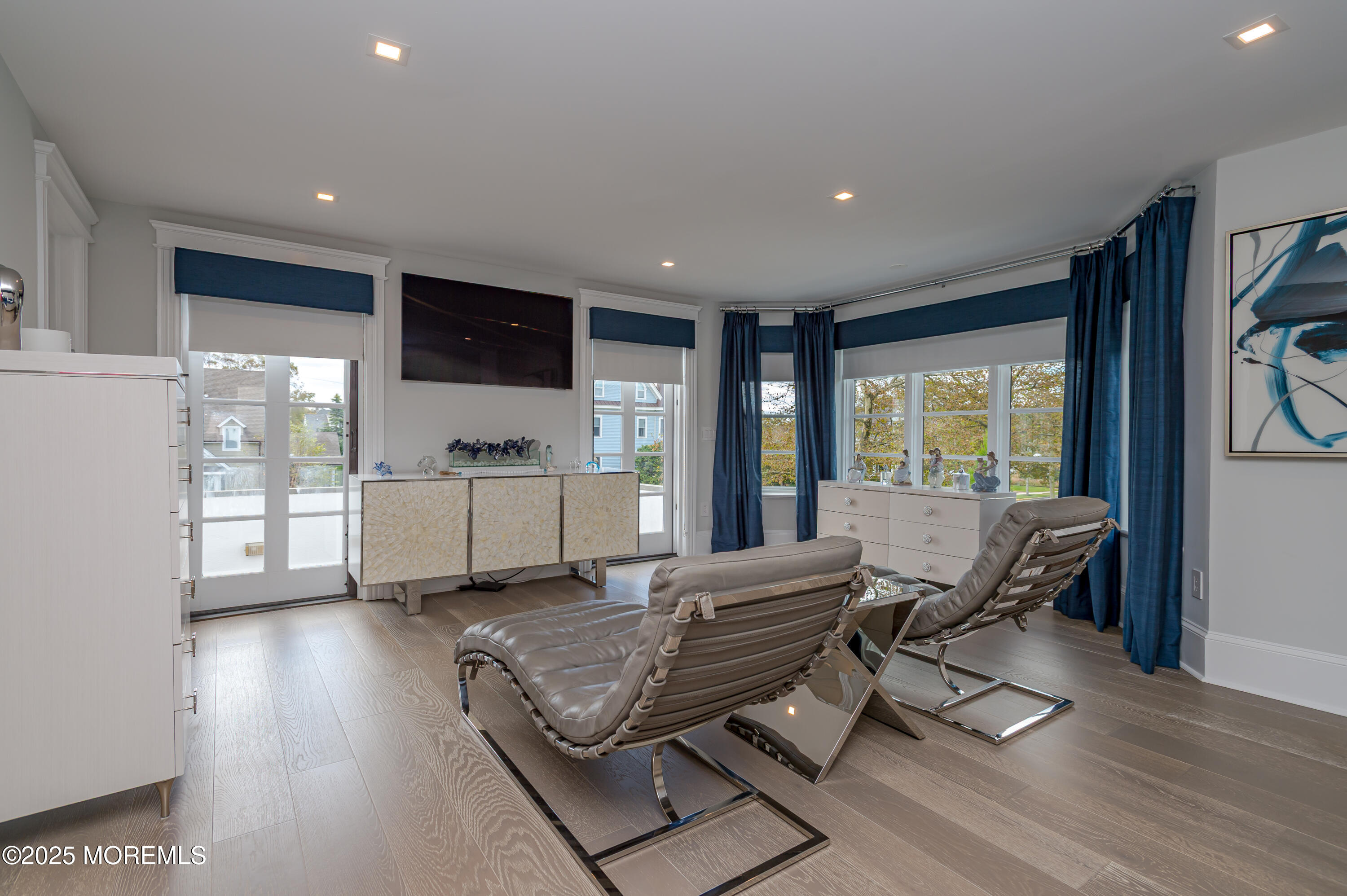 112 Passaic Avenue Spring Lake, NJ 07762 - Photo 27 of 69 a living room with furniture a flat screen tv and floor to ceiling window