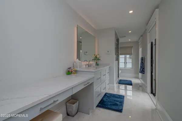 a bedroom with a large bed and a large window