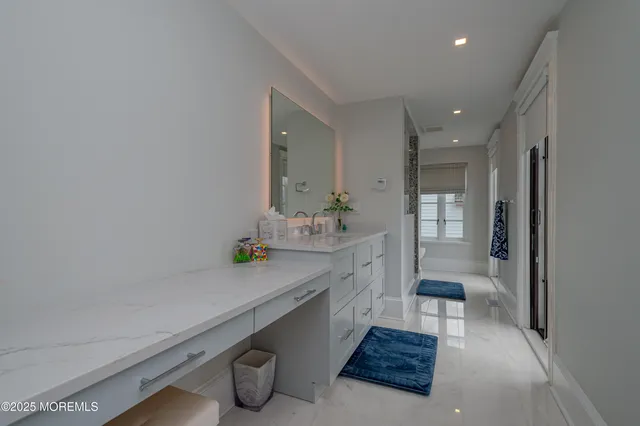 a bedroom with a large bed and a large window