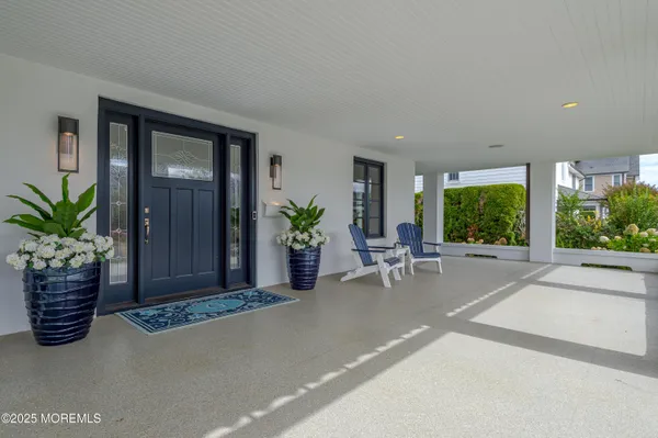 a view of a house with a potted plant and a window