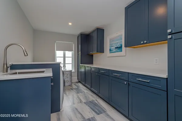 a bathroom with a sink a mirror and a shower
