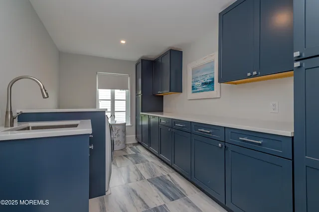 a bathroom with a sink a mirror and a shower