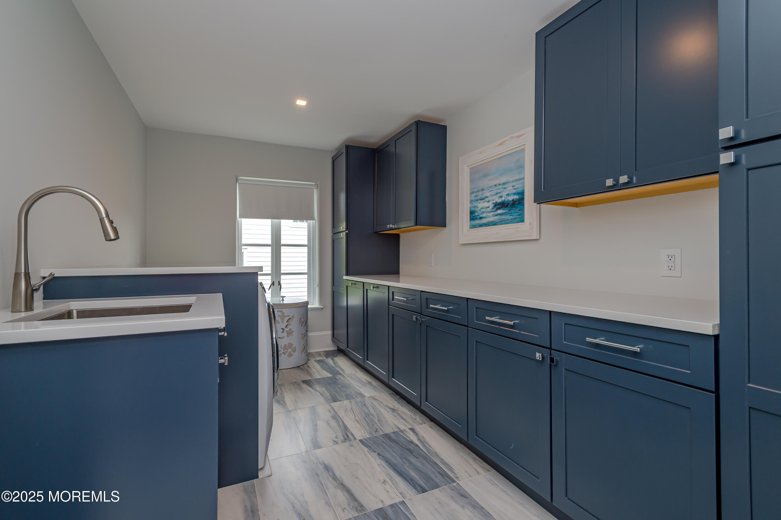 112 Passaic Avenue Spring Lake, NJ 07762 - Photo 32 of 69 a kitchen with kitchen island granite countertop a sink cabinets and wooden floor
