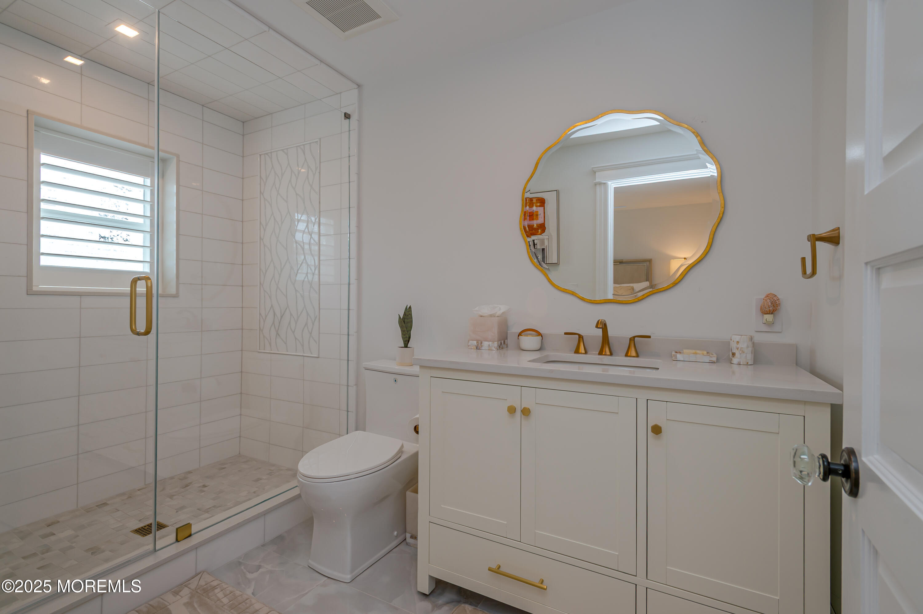 112 Passaic Avenue Spring Lake, NJ 07762 - Photo 34 of 69 a bathroom with a toilet sink and mirror
