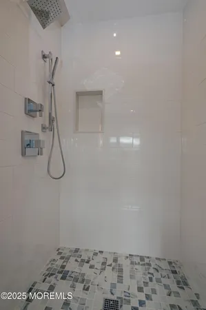 a front view of a house with a garden and yard