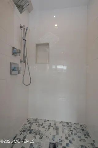 a front view of a house with a garden and yard