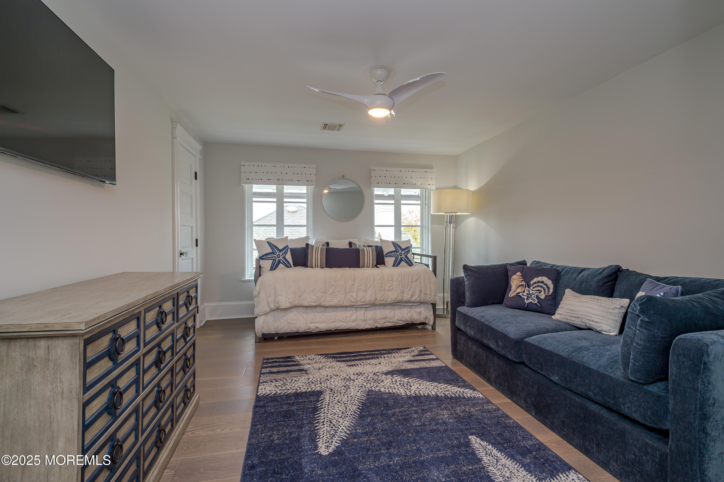 112 Passaic Avenue Spring Lake, NJ 07762 - Photo 41 of 69 a living room with furniture and a flat screen tv