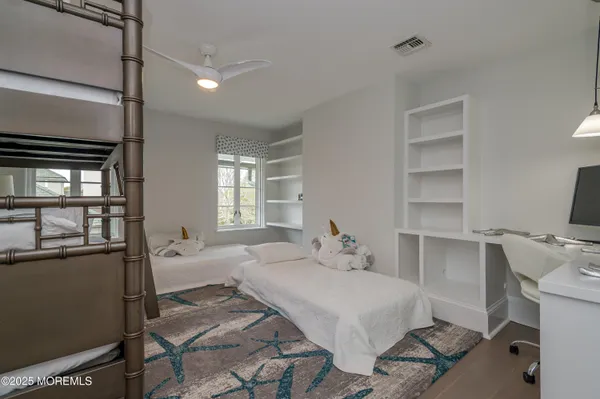 an aerial view of multiple houses with a yard