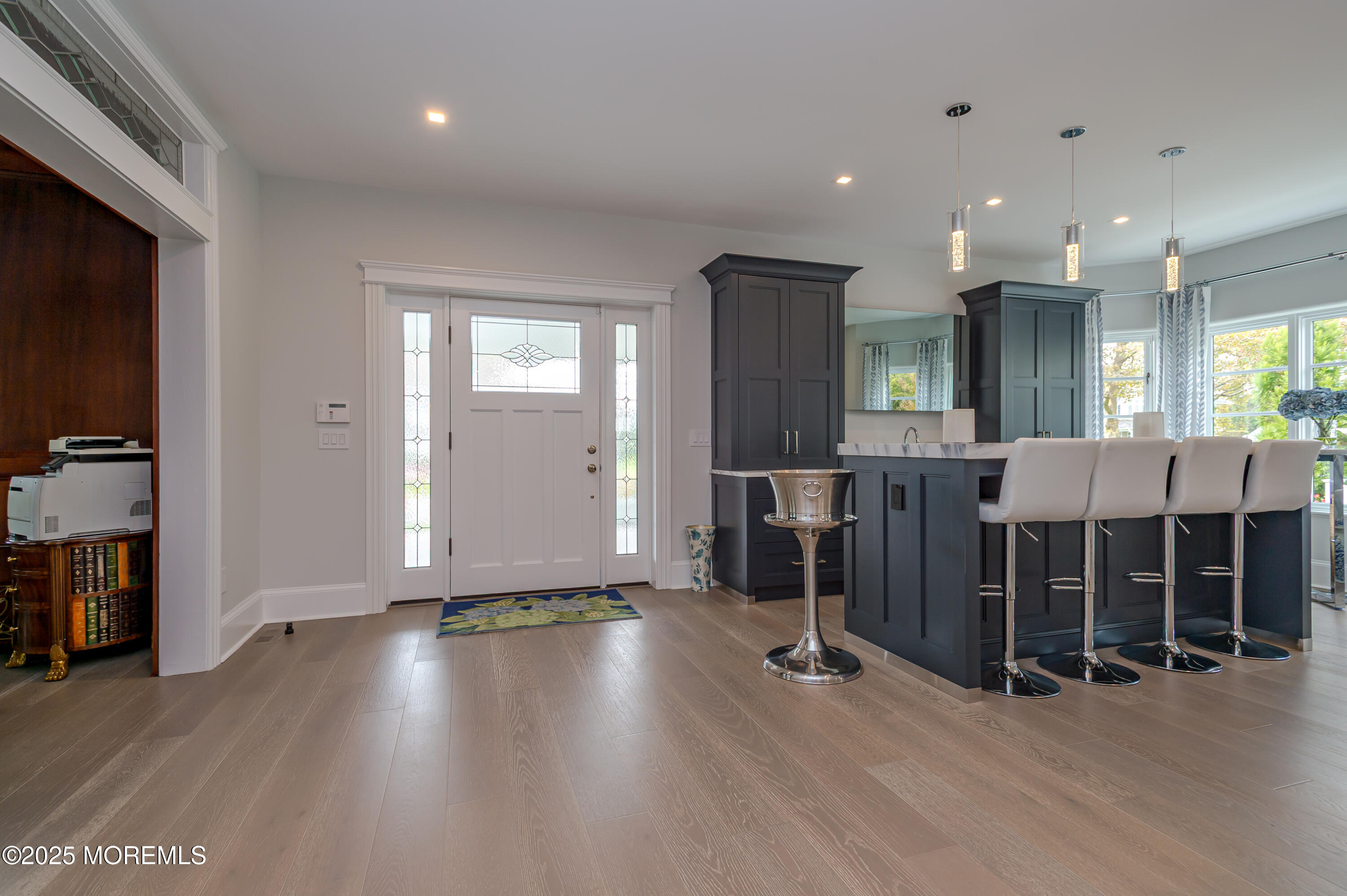 112 Passaic Avenue Spring Lake, NJ 07762 - Photo 5 of 69 a view of a room with wooden floor and windows