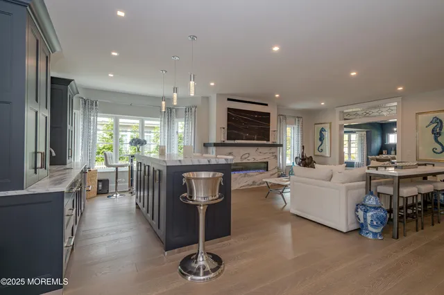 a large kitchen with a table and chairs