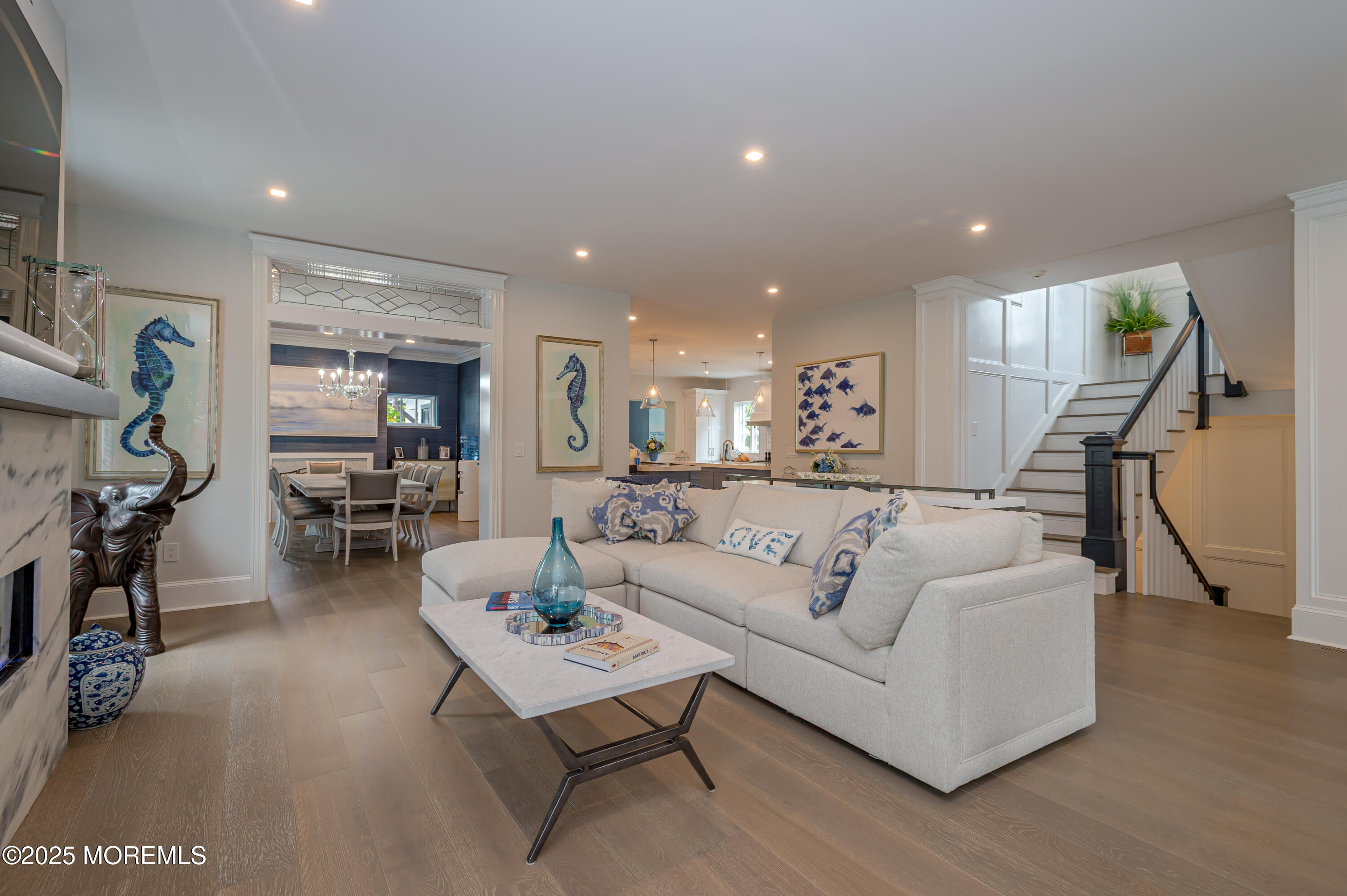 112 Passaic Avenue Spring Lake, NJ 07762 - Photo 10 of 69 a living room with furniture and a gym machine with wooden floor