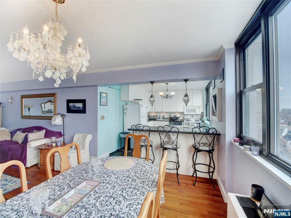 250 Gorge Road, Unit 28A Cliffside Park, NJ 07010 - Photo 15 of 37 a view of a dining room with furniture window and wooden floor