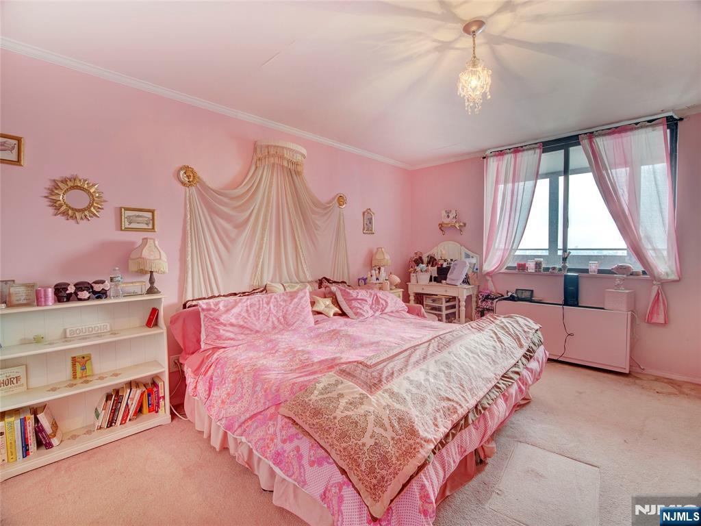 250 Gorge Road, Unit 28A Cliffside Park, NJ 07010 - Photo 20 of 37 a bedroom with a bed dresser and a window