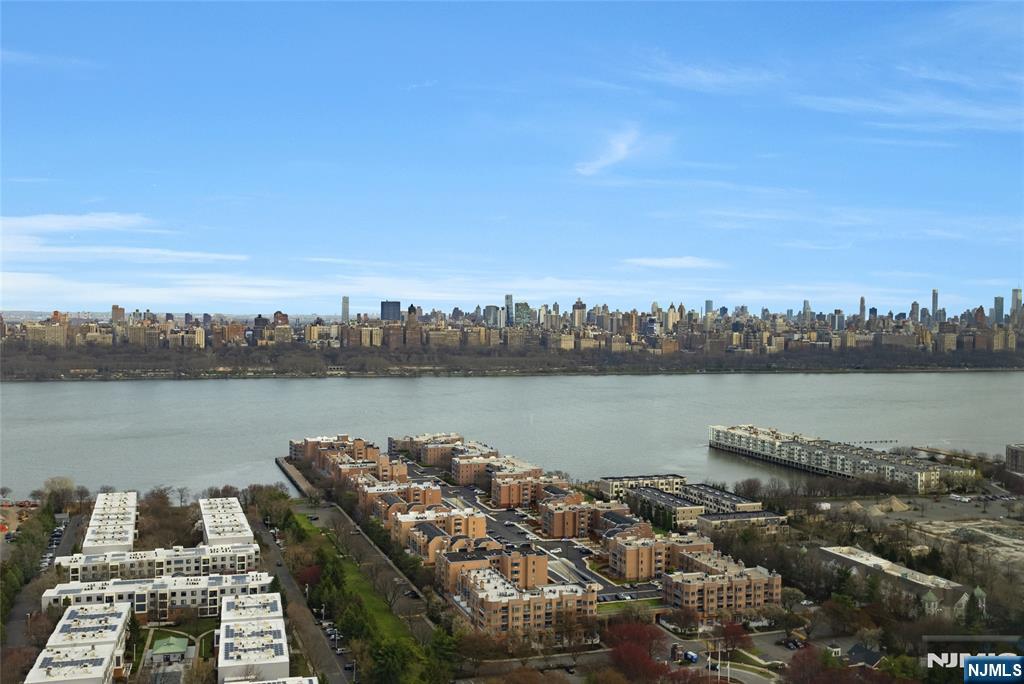 250 Gorge Road, Unit 28A Cliffside Park, NJ 07010 - Photo 24 of 37 a view of a lake with houses in the back