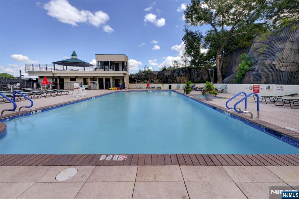 250 Gorge Road, Unit 28A Cliffside Park, NJ 07010 - Photo 25 of 37 a view of a swimming pool with sitting area