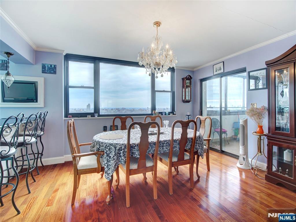 250 Gorge Road, Unit 28A Cliffside Park, NJ 07010 - Photo 10 of 37 a view of a a dining room with furniture window and wooden floor