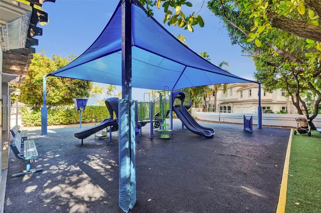 a view of a livingroom with a ceiling fan and window