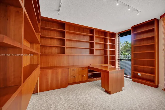 a view of an empty room and a window