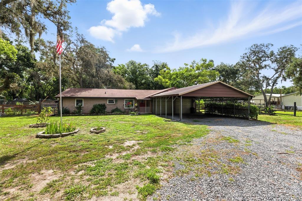 4244 Ryals Road Zephyrhills, FL 33541 - Photo 1 of 1 a view of a house with a yard