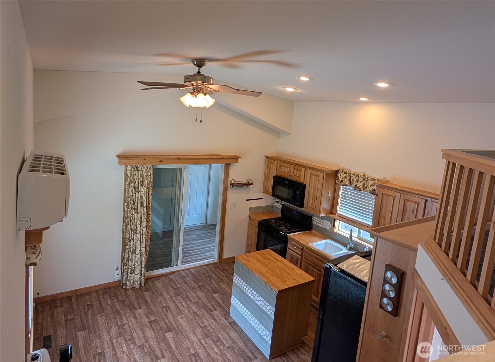 16 Copalis Rv Lane Copalis Beach, WA 98535 - Photo 15 of 39 a view of a workspace with furniture and a ceiling fan