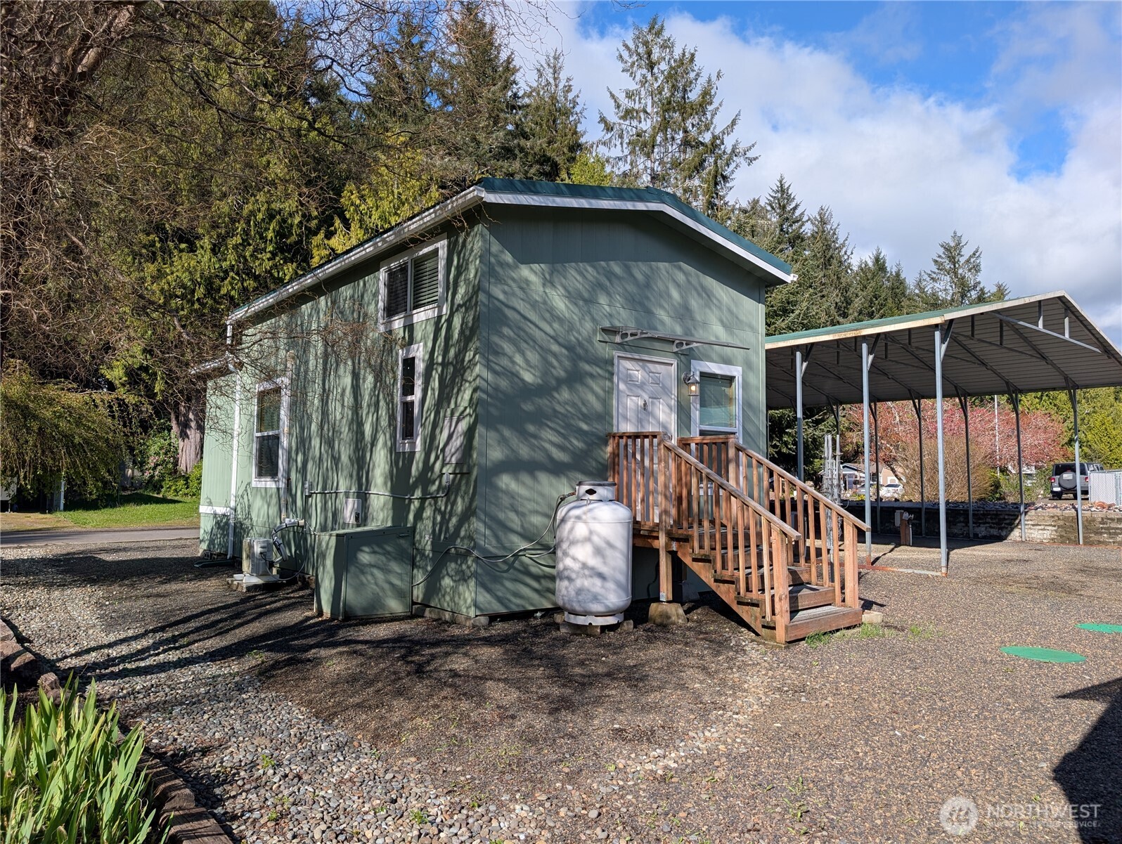 16 Copalis Rv Lane Copalis Beach, WA 98535 - Photo 20 of 39 a view of backyard with small cabin and wooden fence