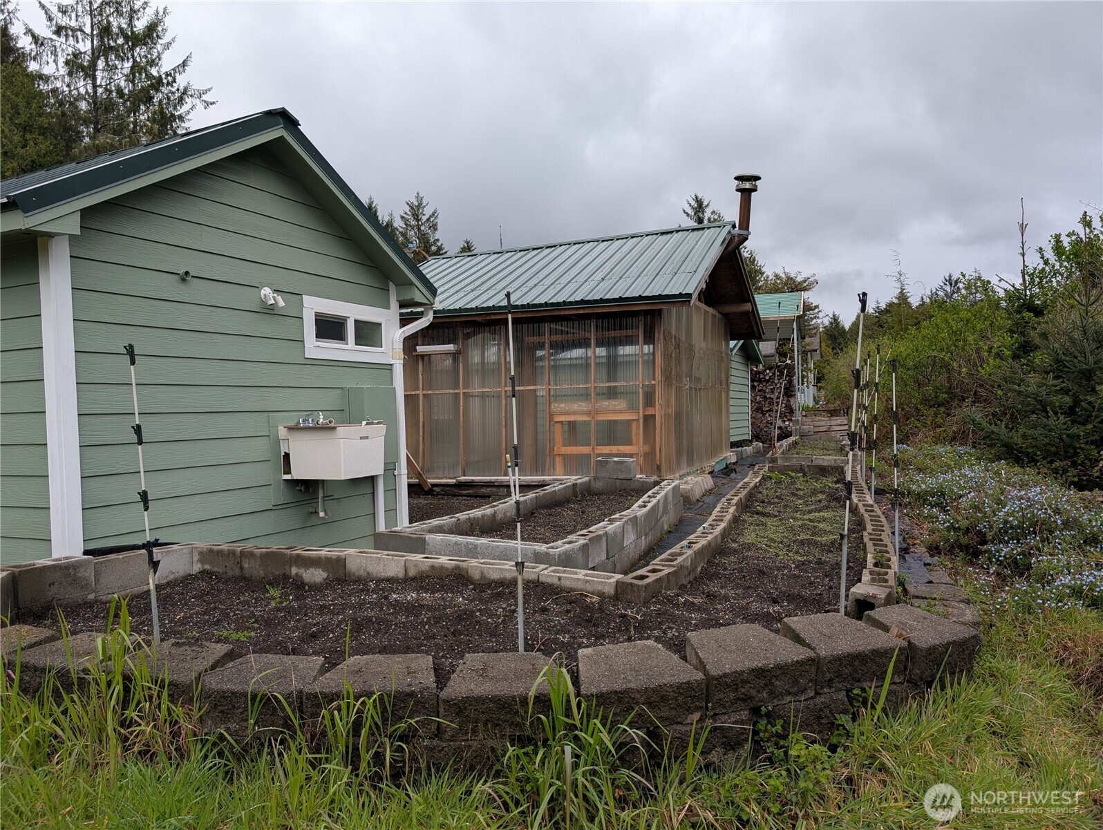 16 Copalis Rv Lane Copalis Beach, WA 98535 - Photo 33 of 39 a view of a house with backyard and sitting area