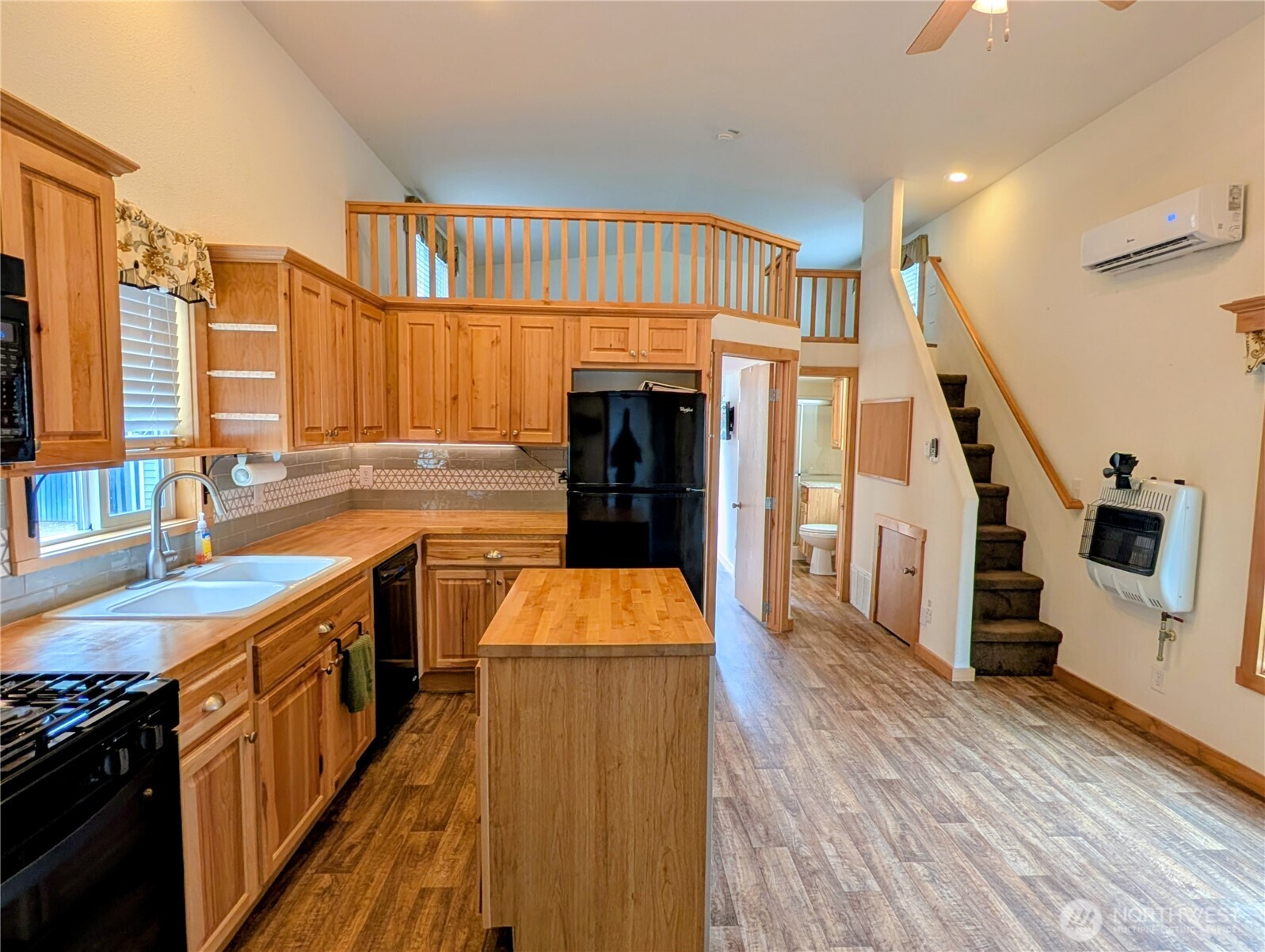 16 Copalis Rv Lane Copalis Beach, WA 98535 - Photo 5 of 39 a kitchen with granite countertop a stove and a wooden floors
