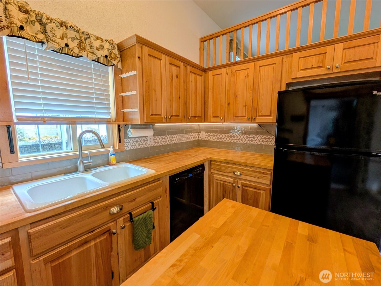 16 Copalis Rv Lane Copalis Beach, WA 98535 - Photo 7 of 39 a kitchen with a refrigerator and a sink