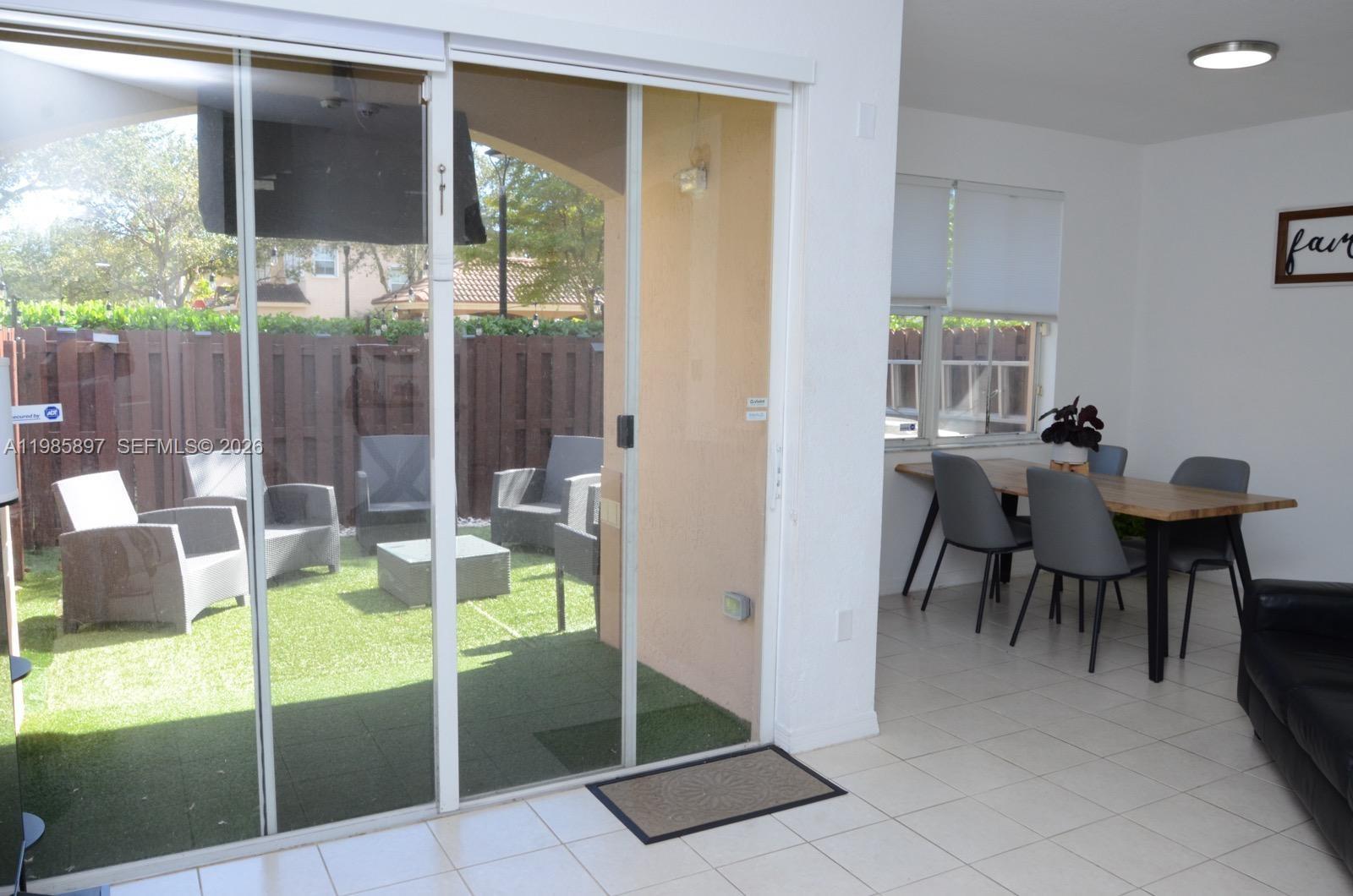 12505 Southwest 124th Court Miami, FL 33186 - Photo 6 of 29 a view of a dining room with furniture window and outside view