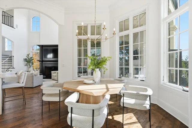 a view of a balcony with a floor to ceiling window next to a yard