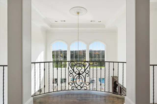 a spacious bathroom with a granite countertop sink and a mirror
